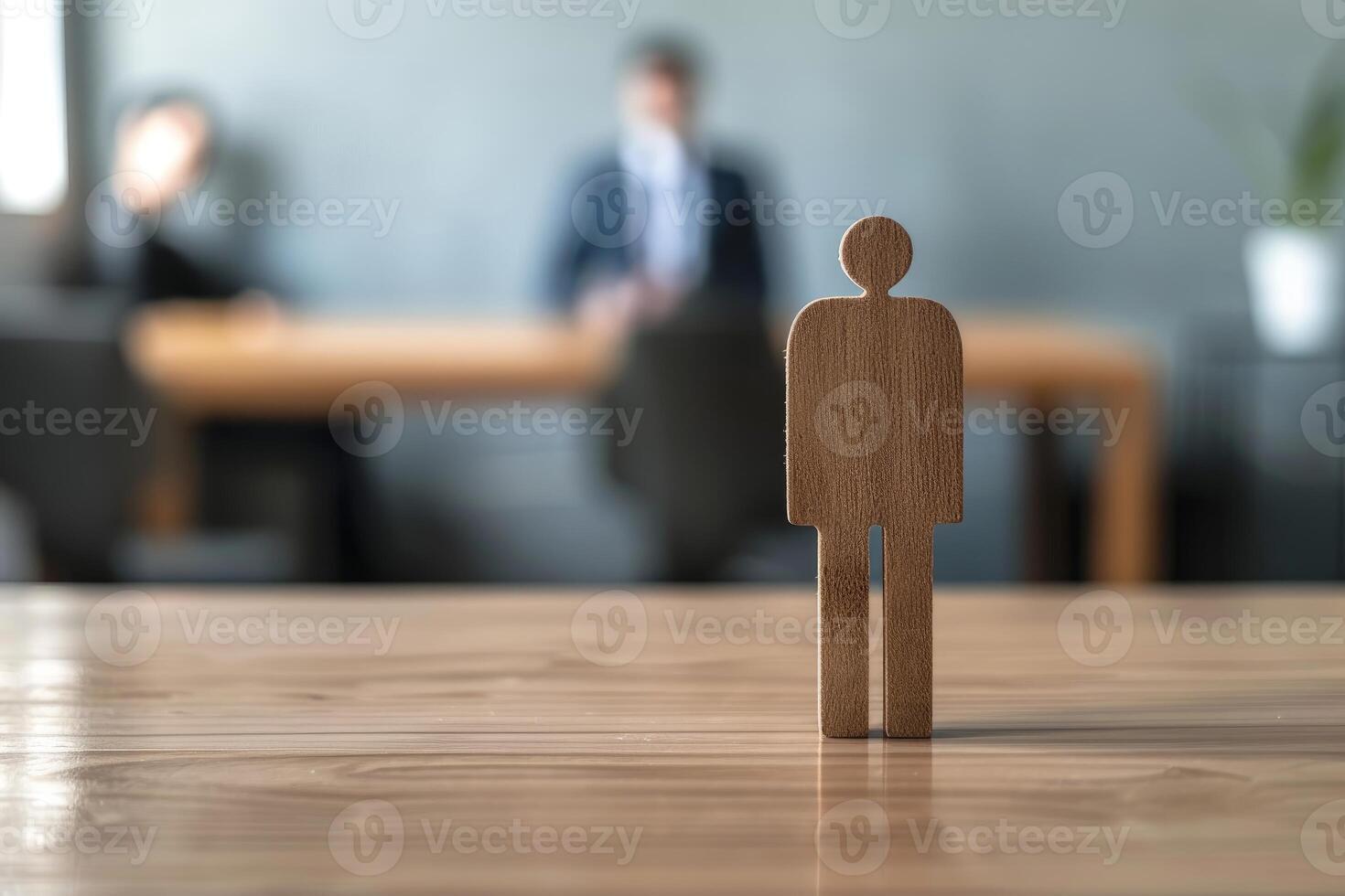 Wooden mannequin stands on table representing candidate during job interview photo