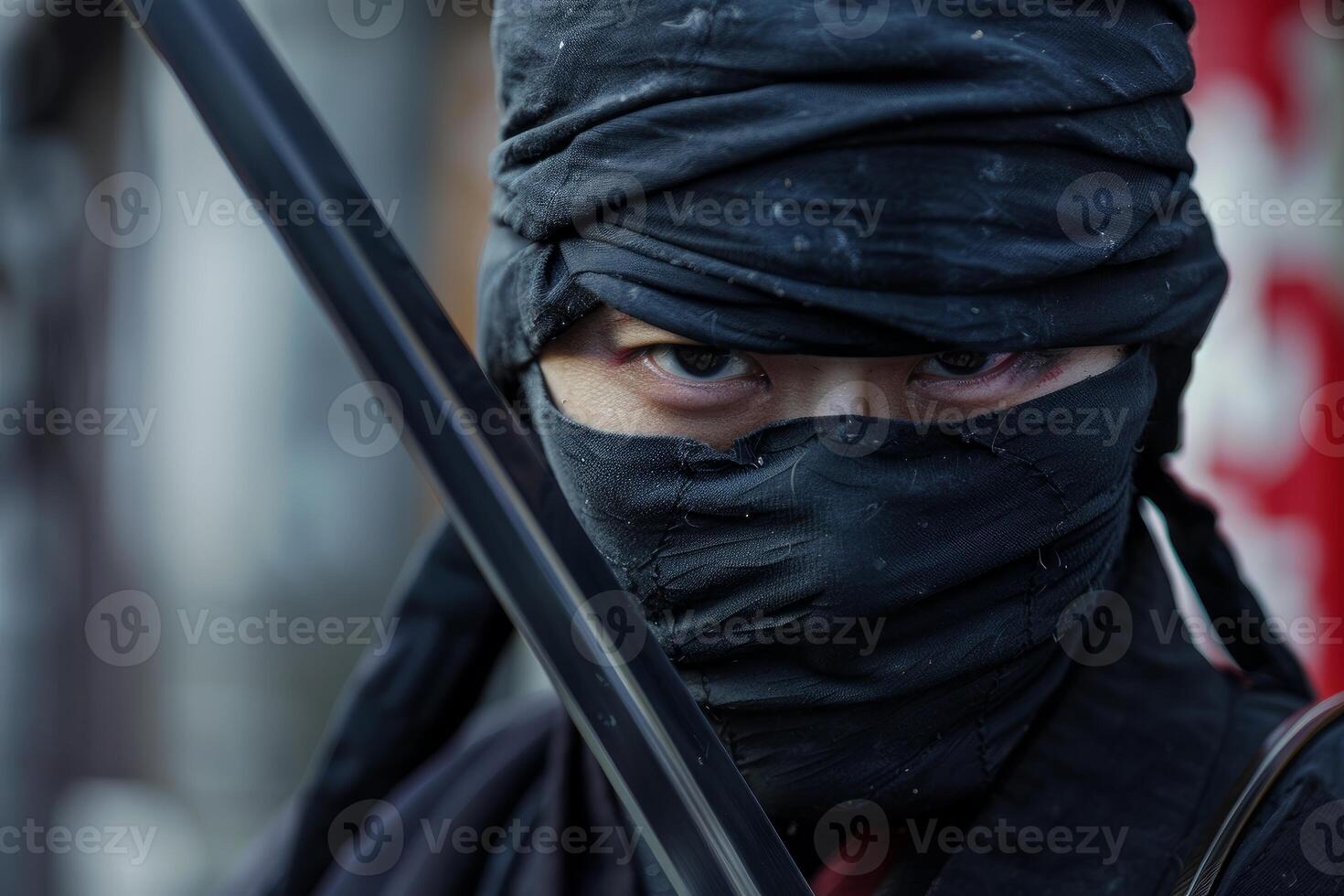 Ninja warrior holding katana covered in black clothes photo