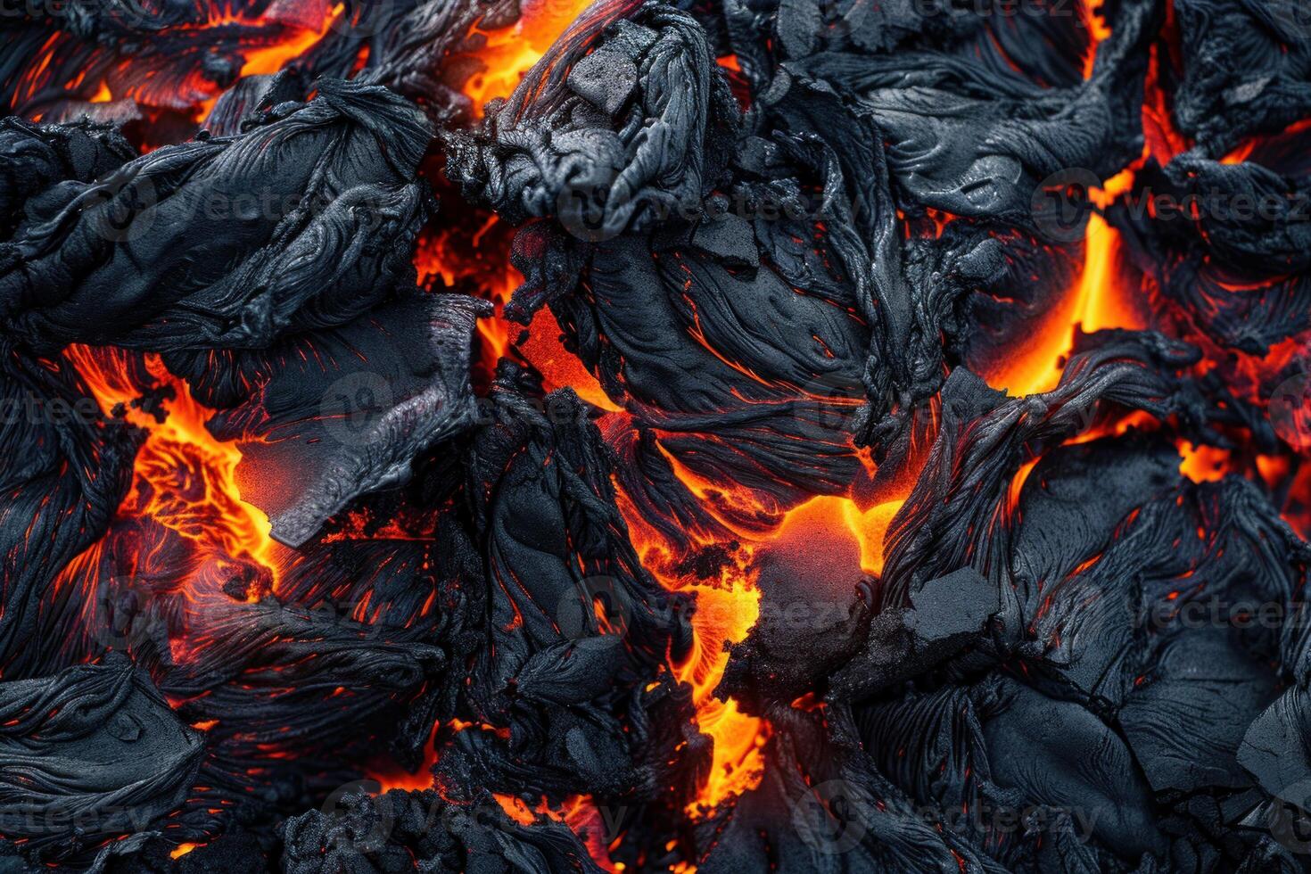 Solidified lava forming intricate patterns with glowing cracks photo