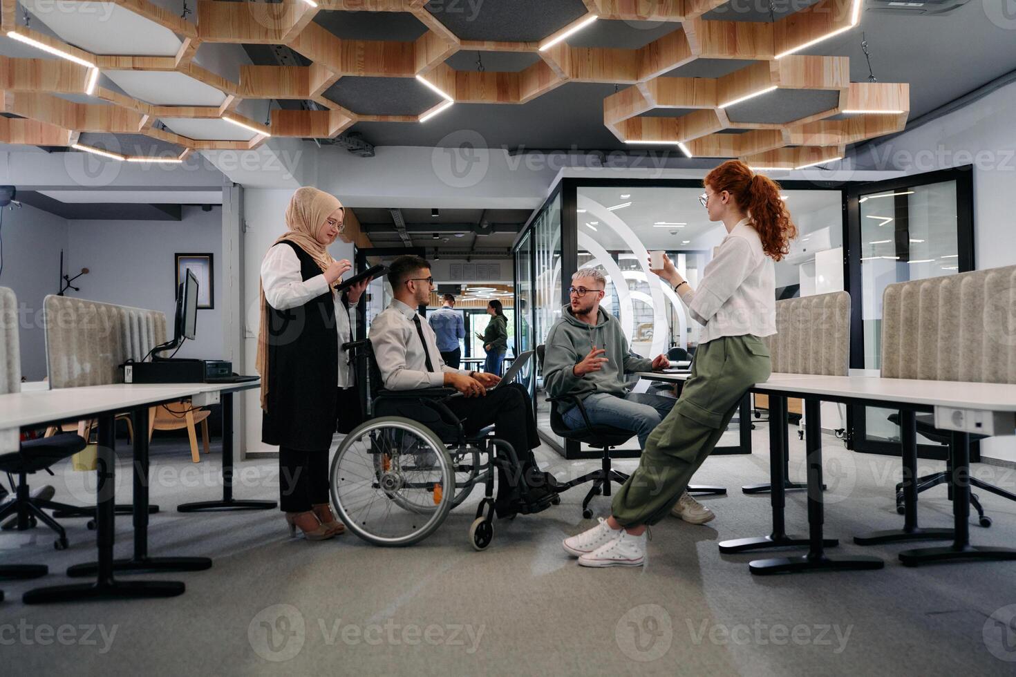 Young group of business people brainstorming together in a startup space, discussing business projects, investments, and solving challenges photo