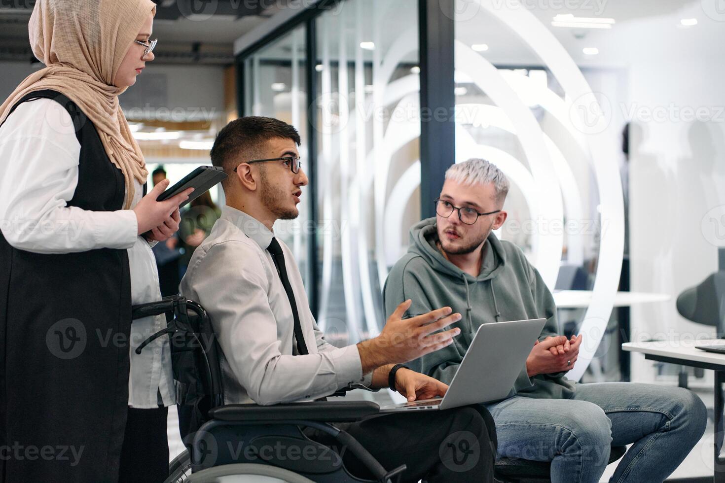 Young group of business people brainstorming together in a startup space, discussing business projects, investments, and solving challenges photo