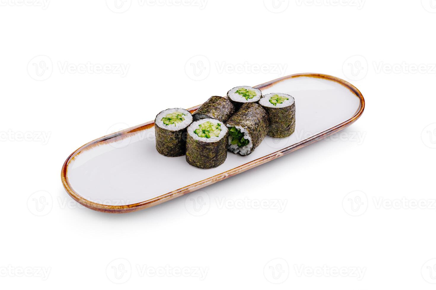 Sushi rolls arranged neatly on a rectangular plate with a minimalistic design in a bright setting photo