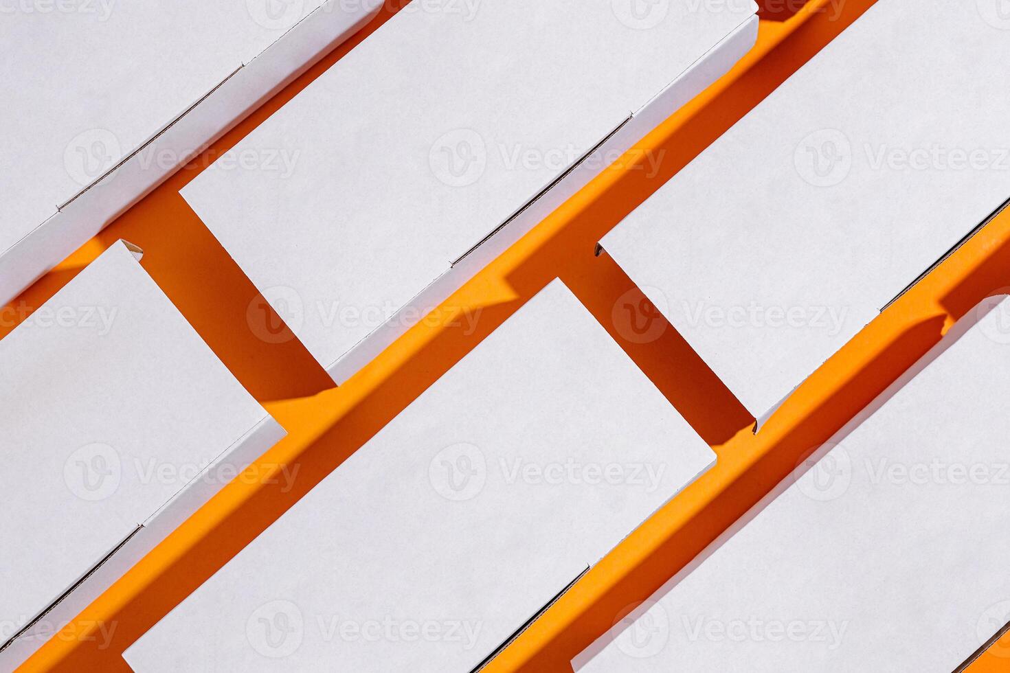 white cardboard food boxes for delivery on a yellow background photo