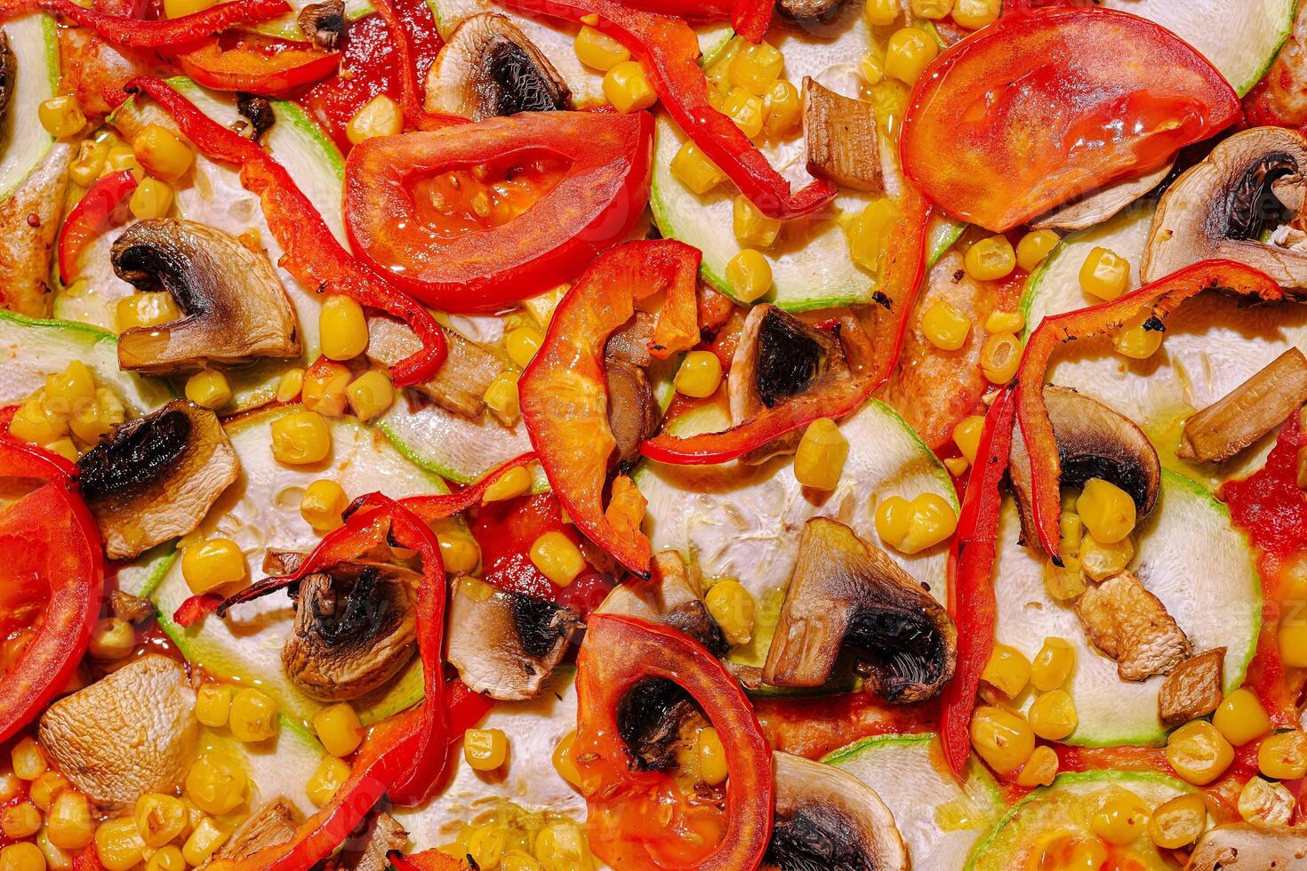 Colorful vegetable medley on a pizza with mushrooms, peppers, corn, and tomatoes arranged appealingly photo