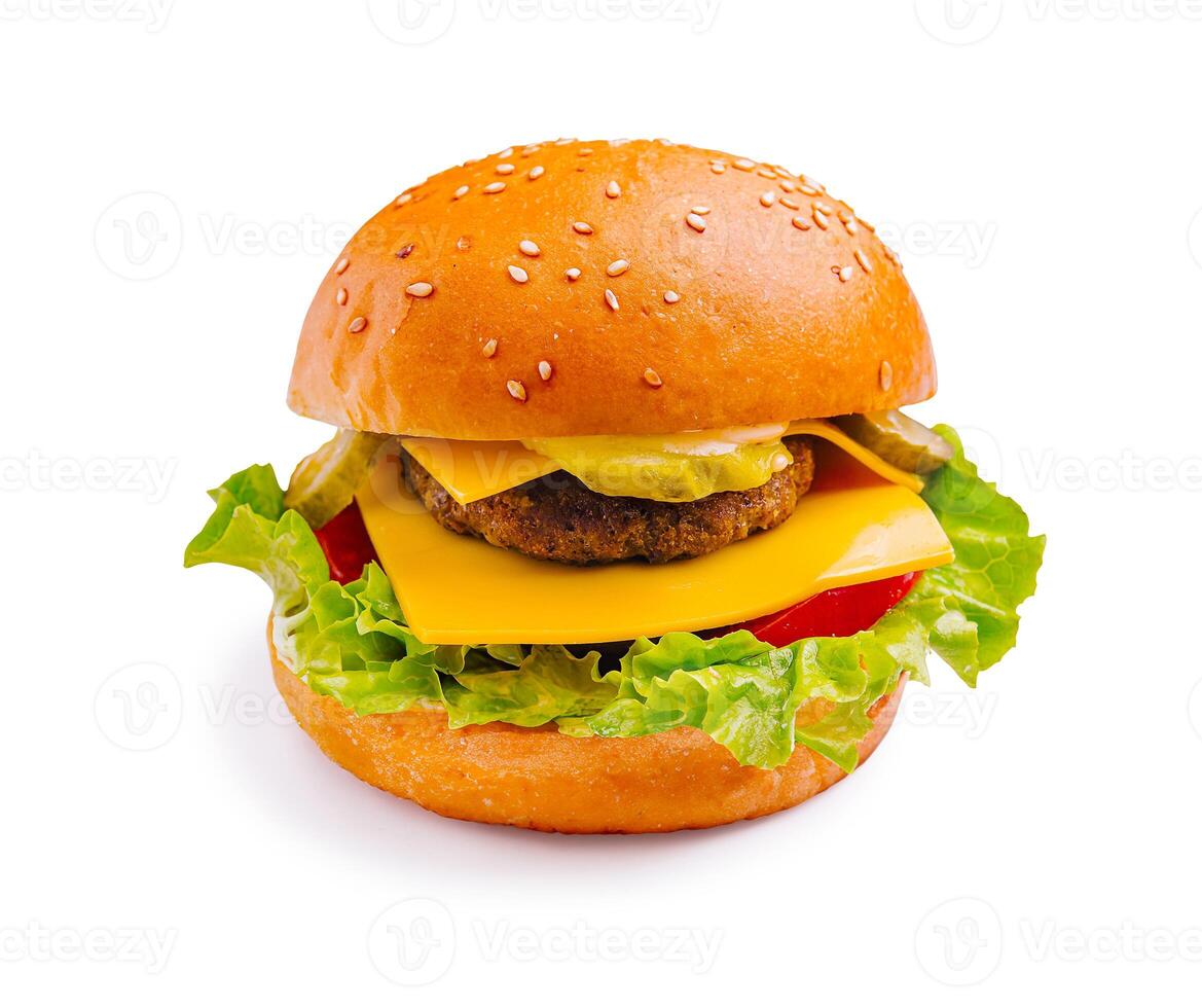Delicious cheeseburger with fresh lettuce, tomatoes, and pickles served on a sesame seed bun photo