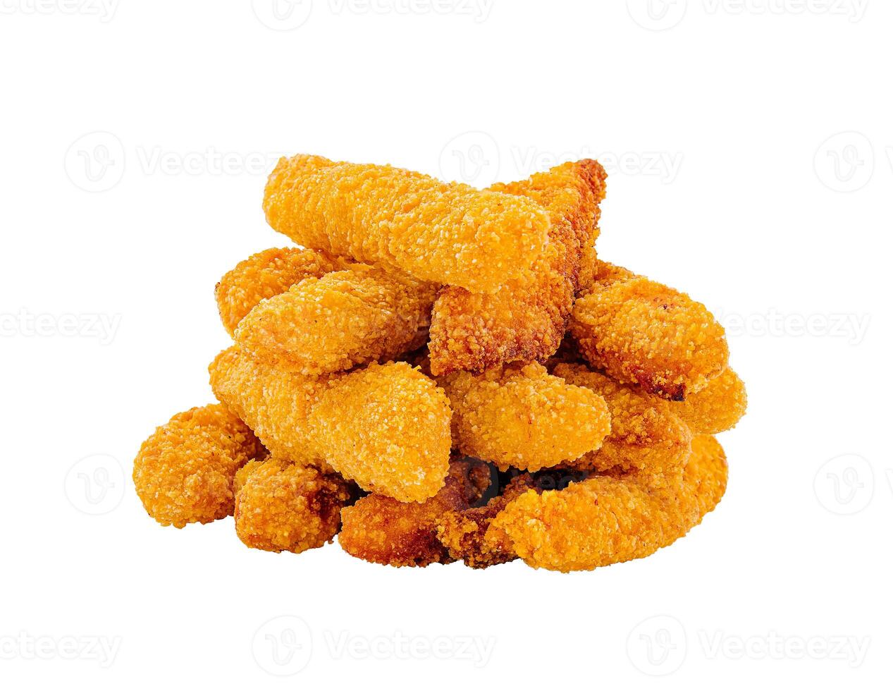 Crispy golden chicken strips stacked on a white background ready for serving or enjoying at a casual meal photo