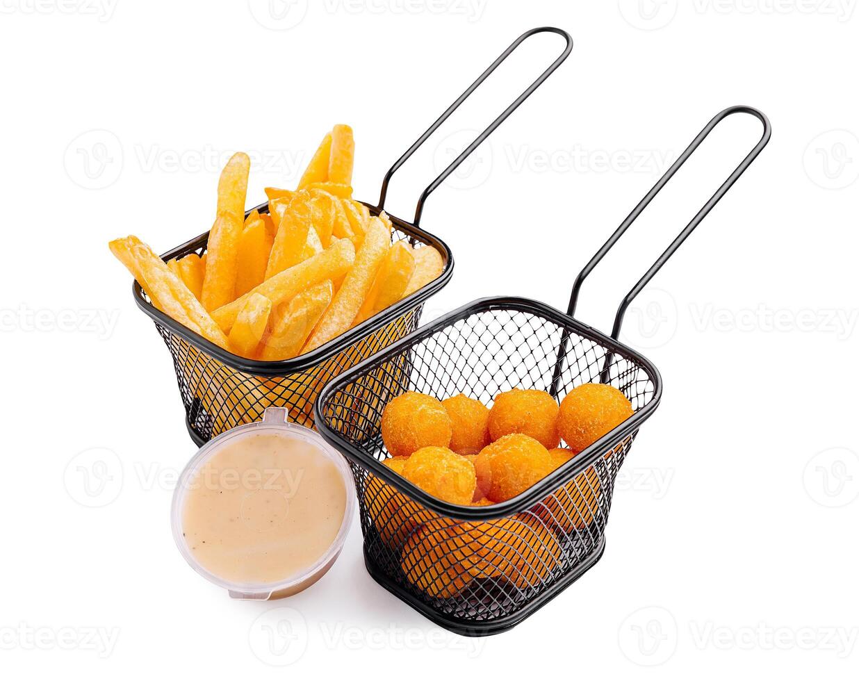 Delicious fried snacks served in mini baskets with dipping sauce and crispy fries photo