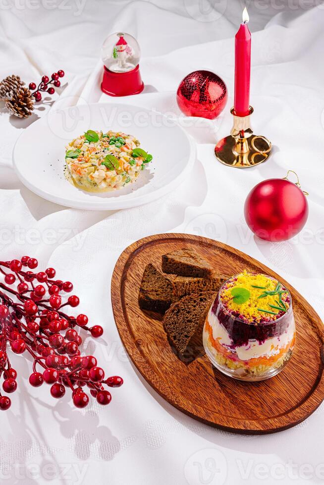 Festive table setting with holiday treats and decorations, featuring colorful desserts and seasonal decor photo