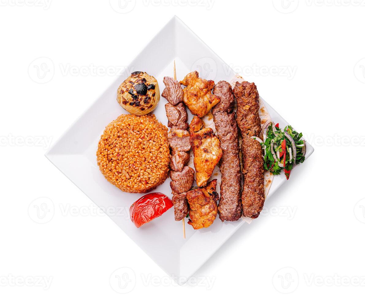 Delicious assorted kebabs served with bulgur, grilled tomatoes, and a fresh side salad in a modern presentation photo