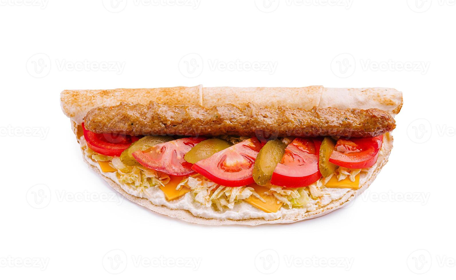 Delicious kebab wrap filled with fresh vegetables and savory ingredients served on a white background photo