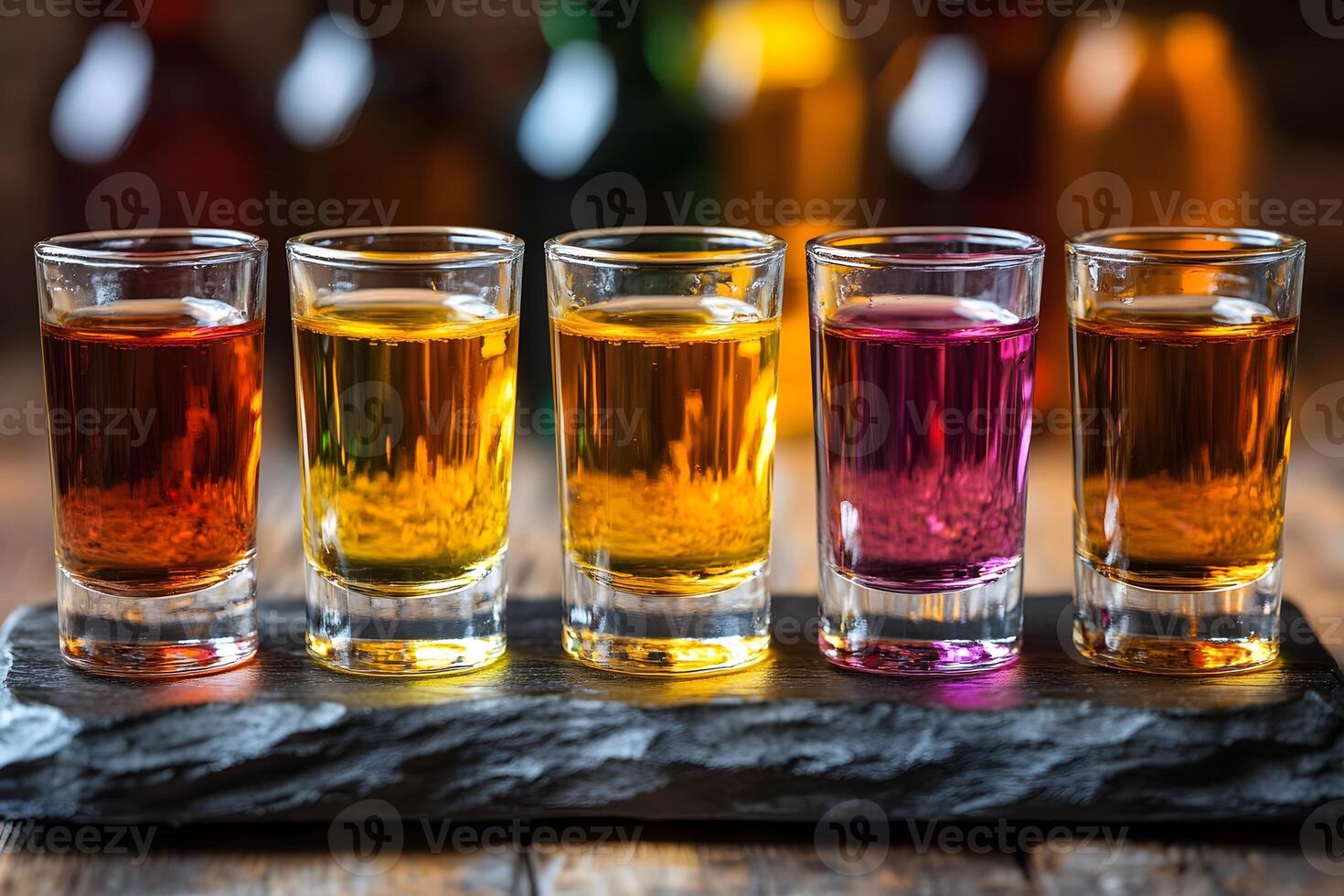 Colorful Assortment of Shots on Rustic Slate Tray for Lively Bar Decor and Beverage Menu Design photo