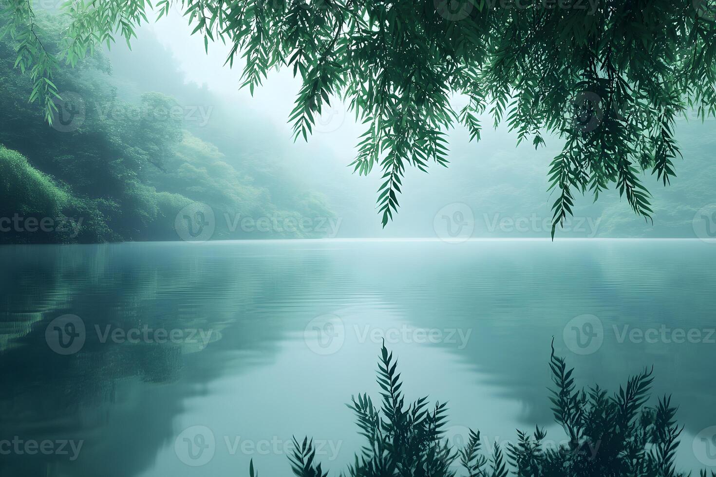 Serene Misty Lake Landscape with Reflections and Lush Green Foliage photo