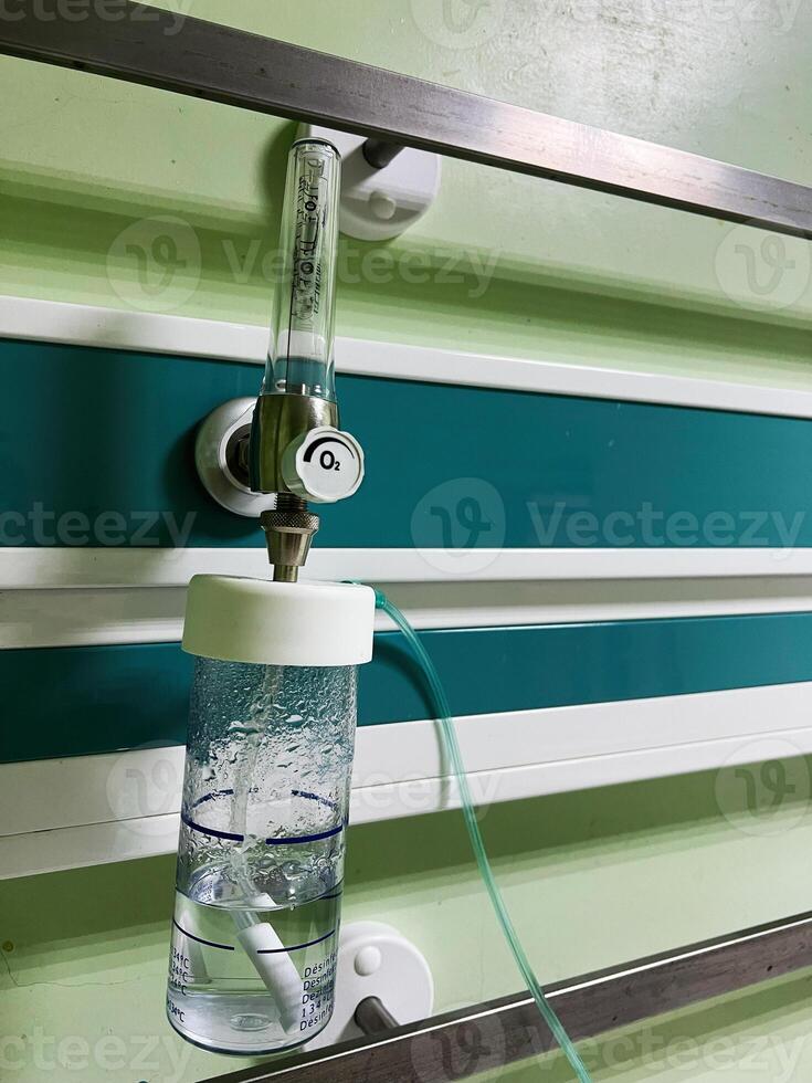 Oxygen flow meter with bubbler in a medical room interior photo