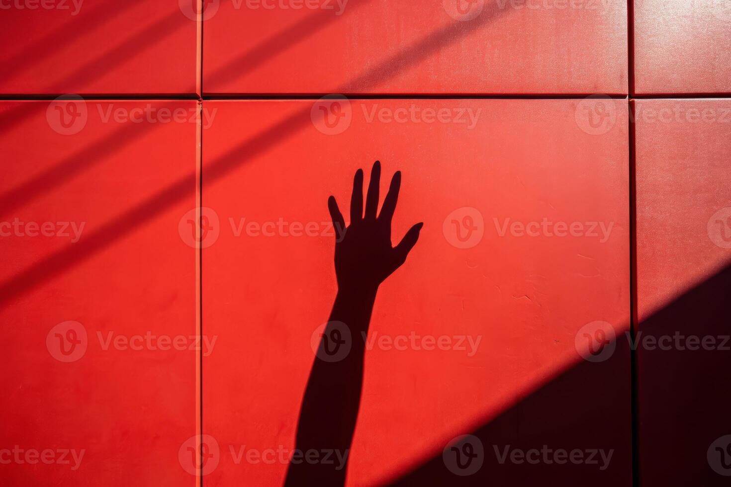 Death's shadow a hand reaching across a red wall symbolizing loss and reflection urban setting artistic perspective photo