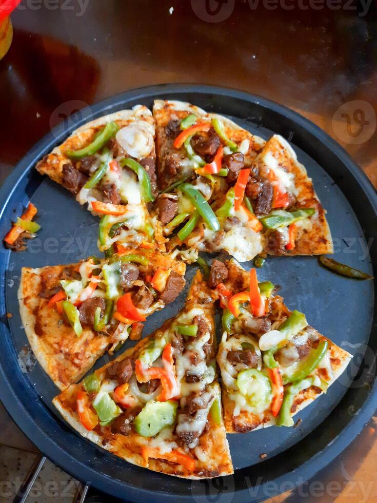 Pizza is a popular food in the western world photo
