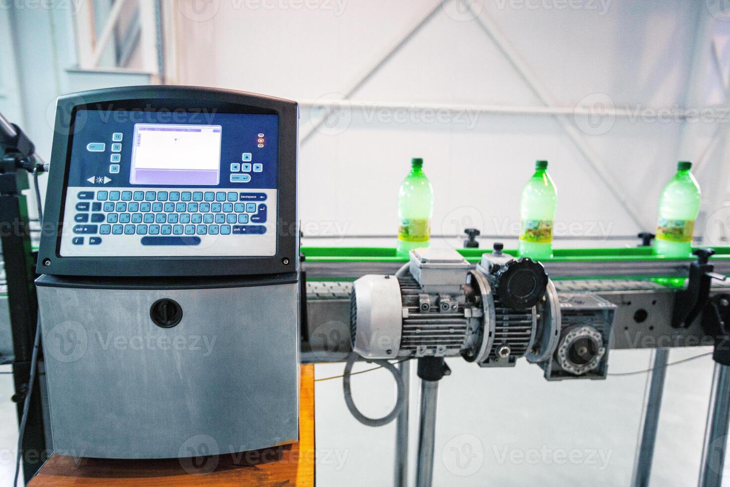High-tech bottling line in a factory with automated machinery processing beverages photo