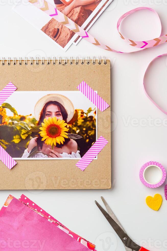 Bright and colorful scrapbook layout featuring a woman with a sunflower in a vibrant garden setting photo