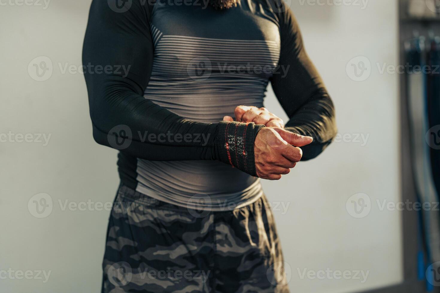 Man preparing for weightlifting session in gym with focus on strength training and fitness photo