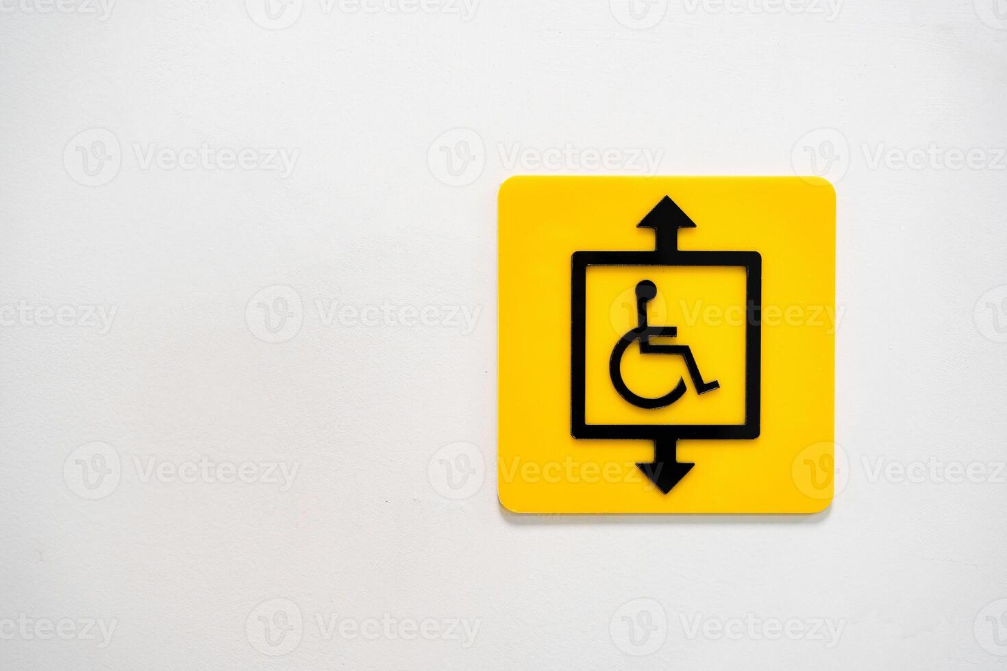 Sign indicating an accessible elevator for individuals with disabilities in a public space photo