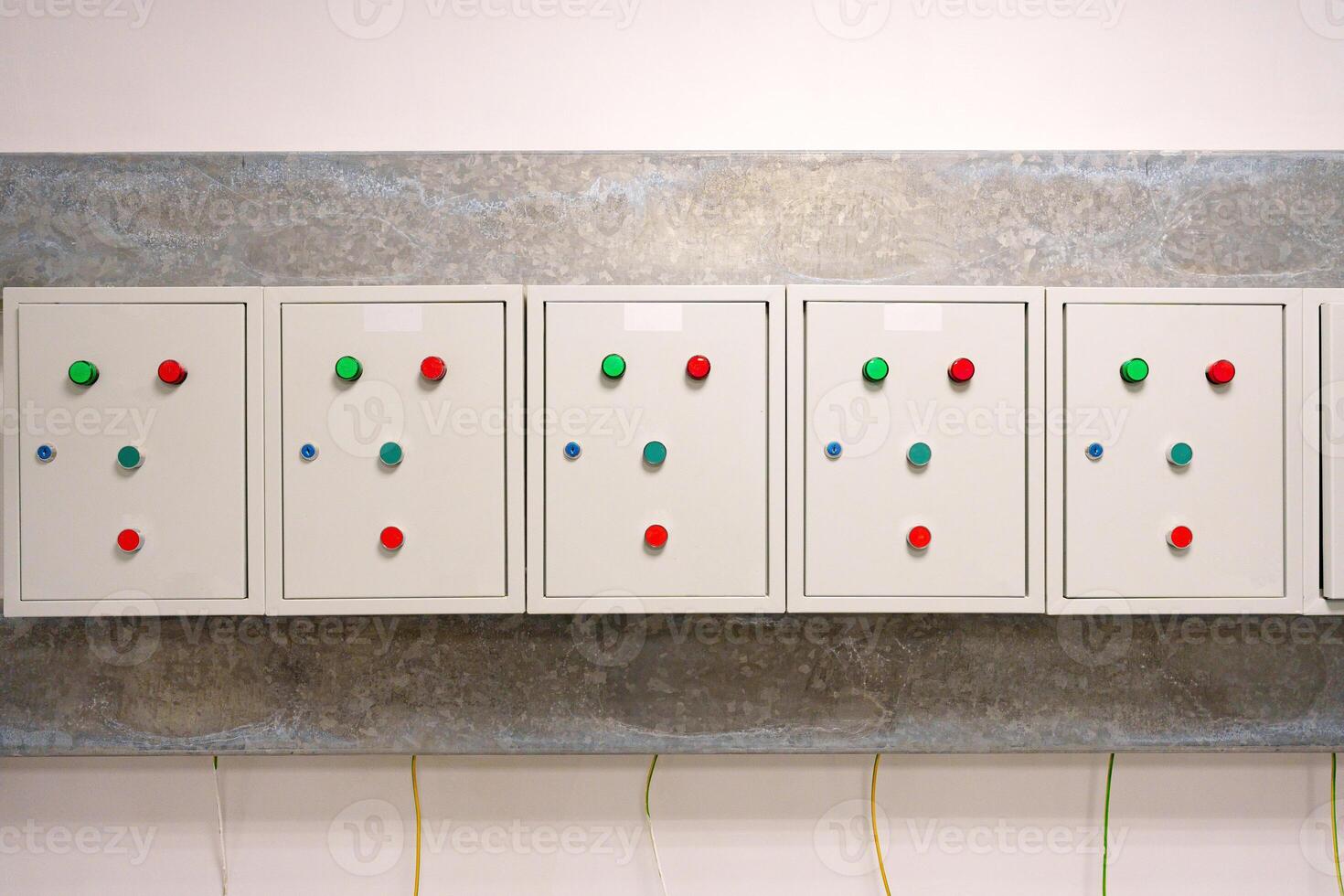 Control panel with indicator lights and buttons in a modern industrial setting photo