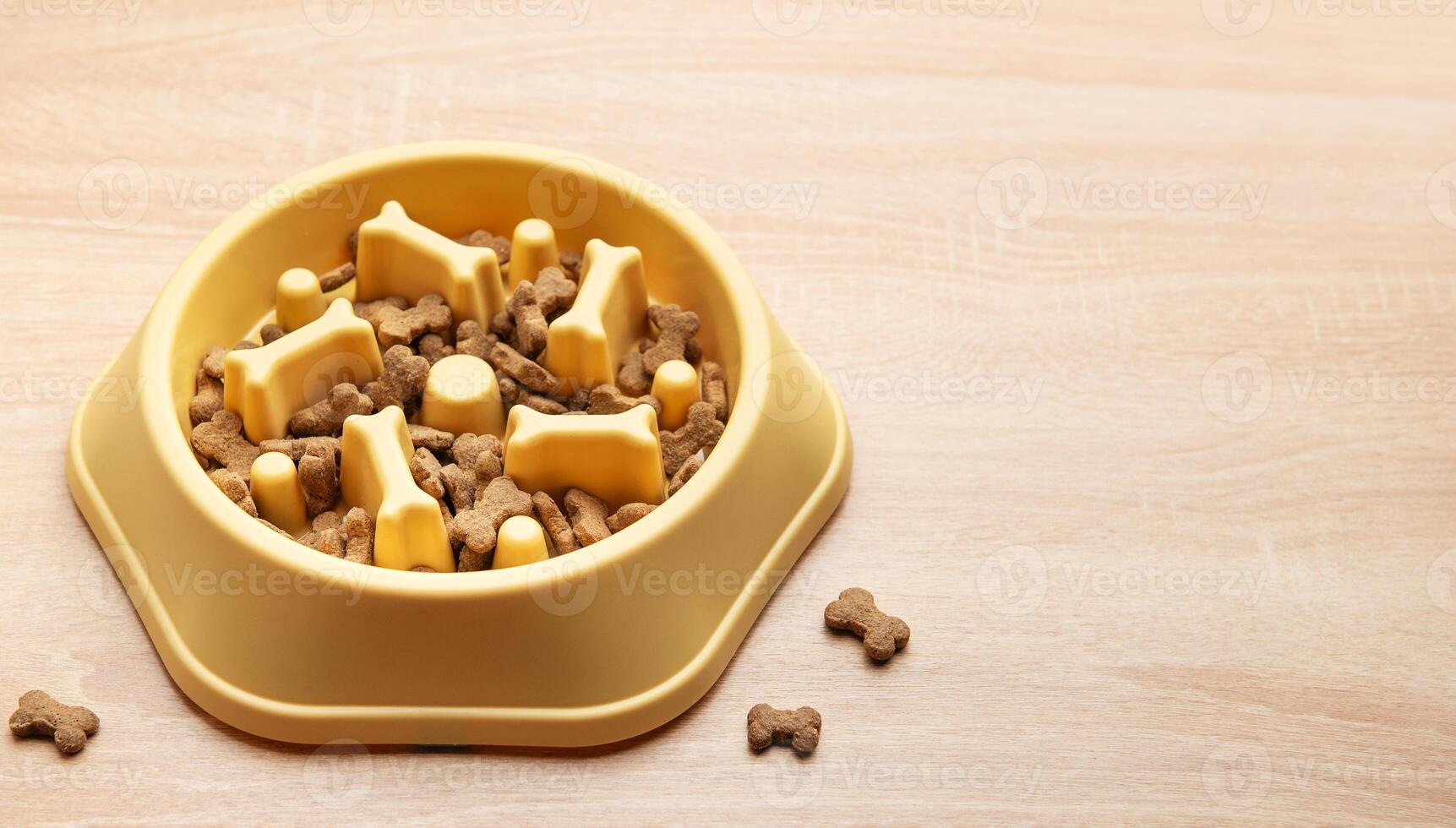 Slow yellow feeder dog bowl preventing gulping and improving digestion photo
