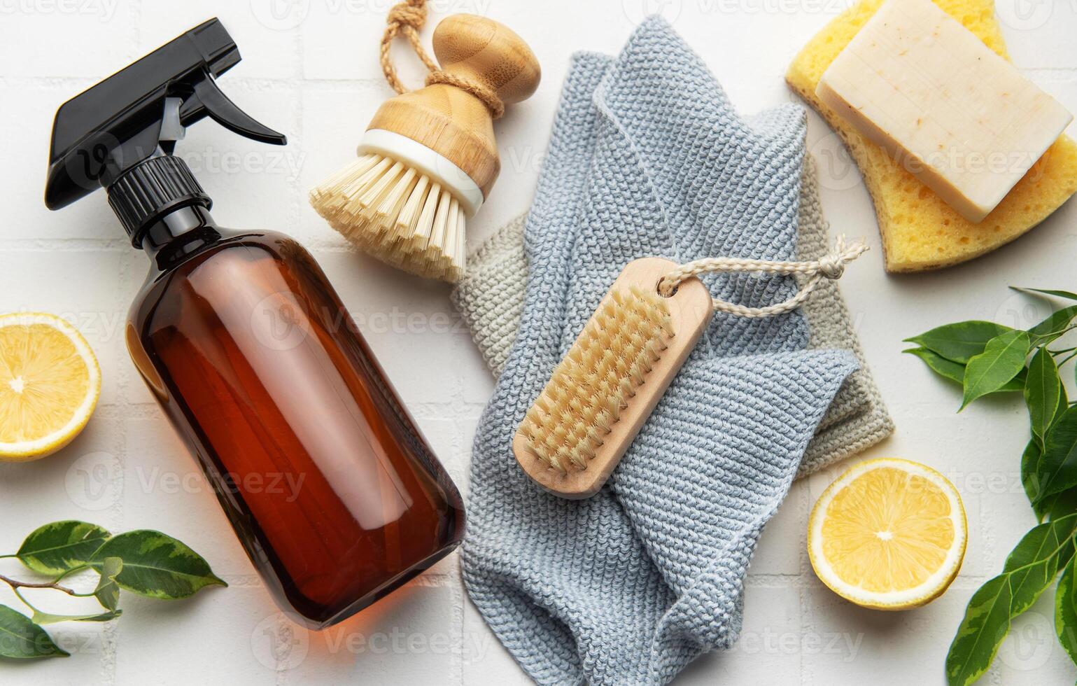 Eco friendly cleaning products promoting sustainable lifestyle on white tile background photo