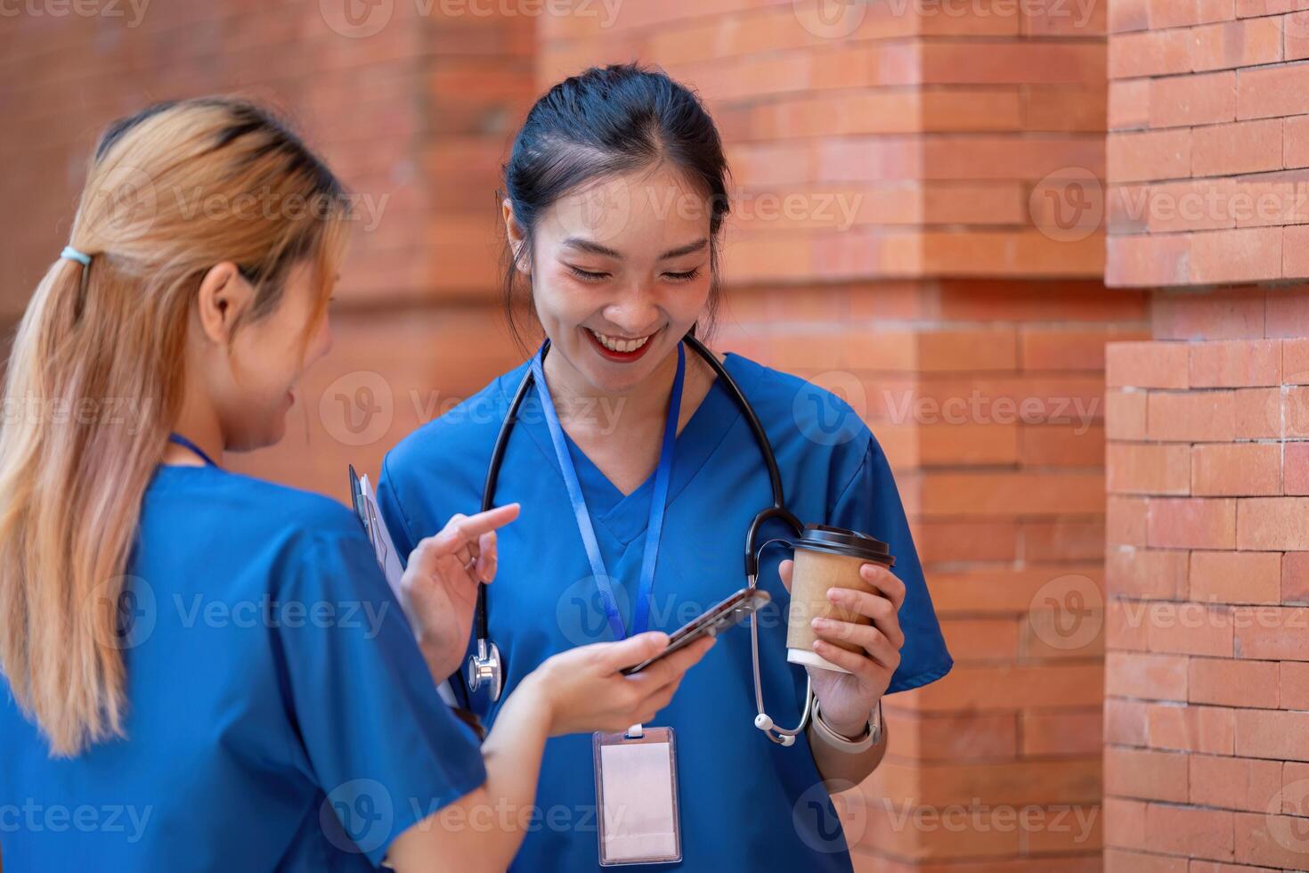 Doctors conversing during a break, sharing smiles and coffee. photo