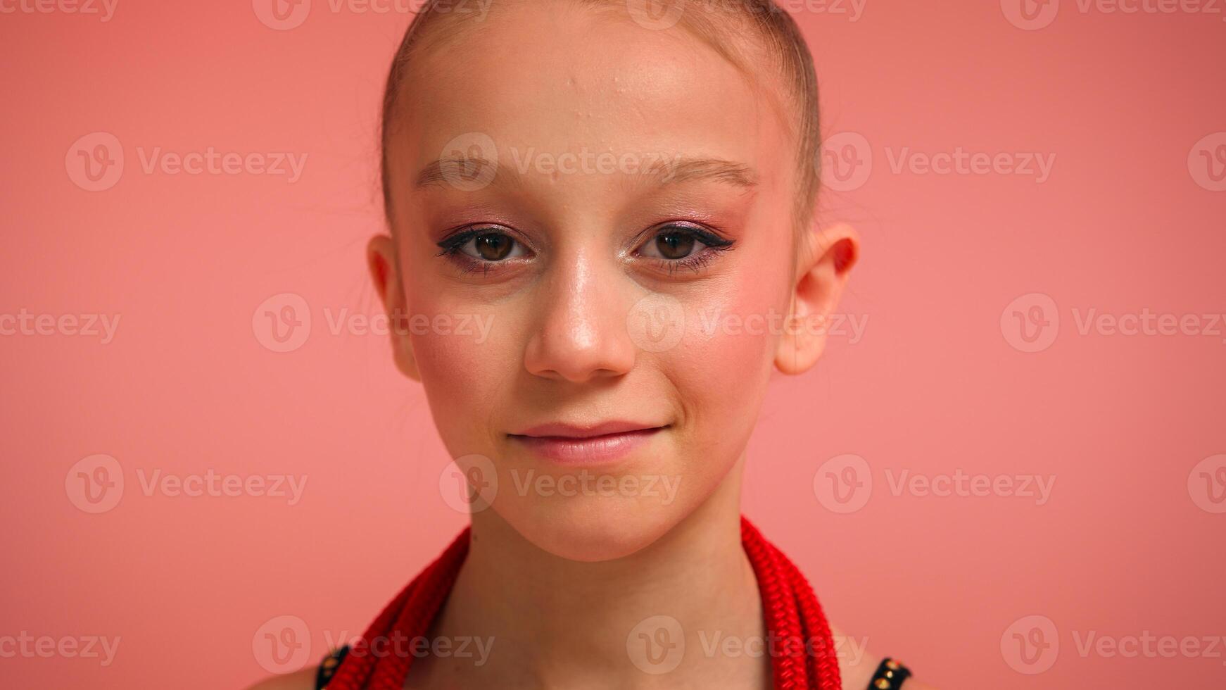 Kid portrait in studio female child pretty little girl sport ballerina dancer gymnast acrobat gymnastics competition happy daughter school schoolgirl smiling pink background children beauty childhood photo