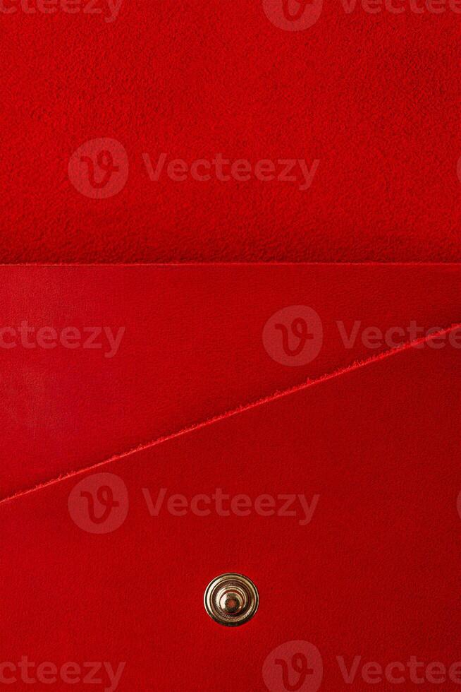 Red leather suede wallet as a background macro photo. photo