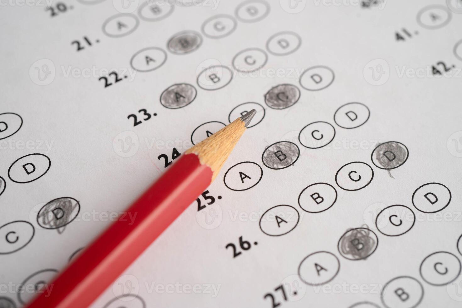 Answer sheets with pencil drawing fill to select photo
