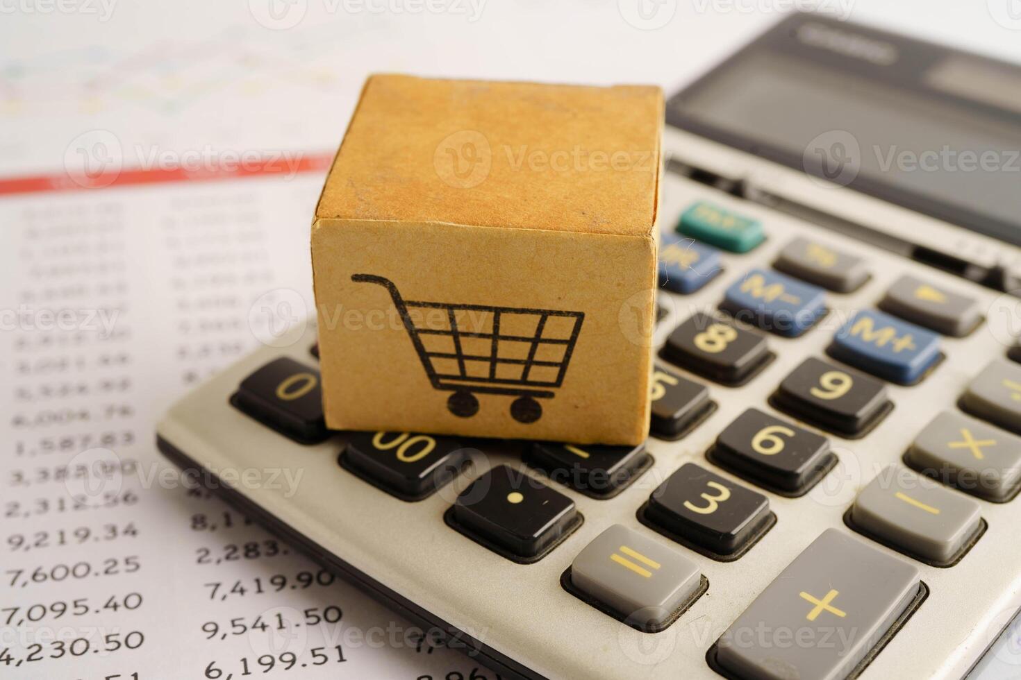 Online shopping, Shopping cart box on calculator, import export, photo