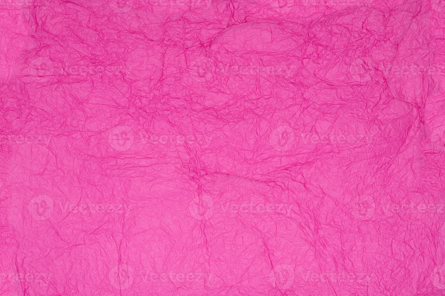Pink crinkled tissue paper background. Recycling gift packaging for holidays Valentines photo