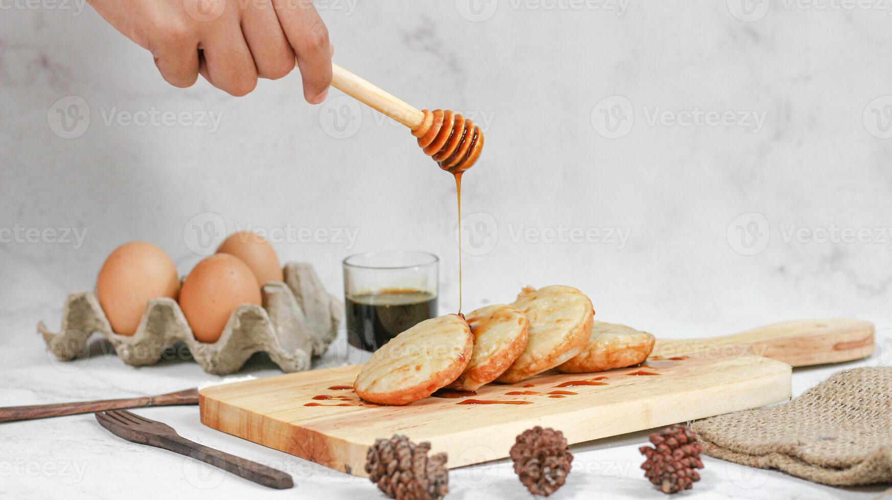 Delicious Serabi with Honey Drizzle Indonesian Sweet Treat photo