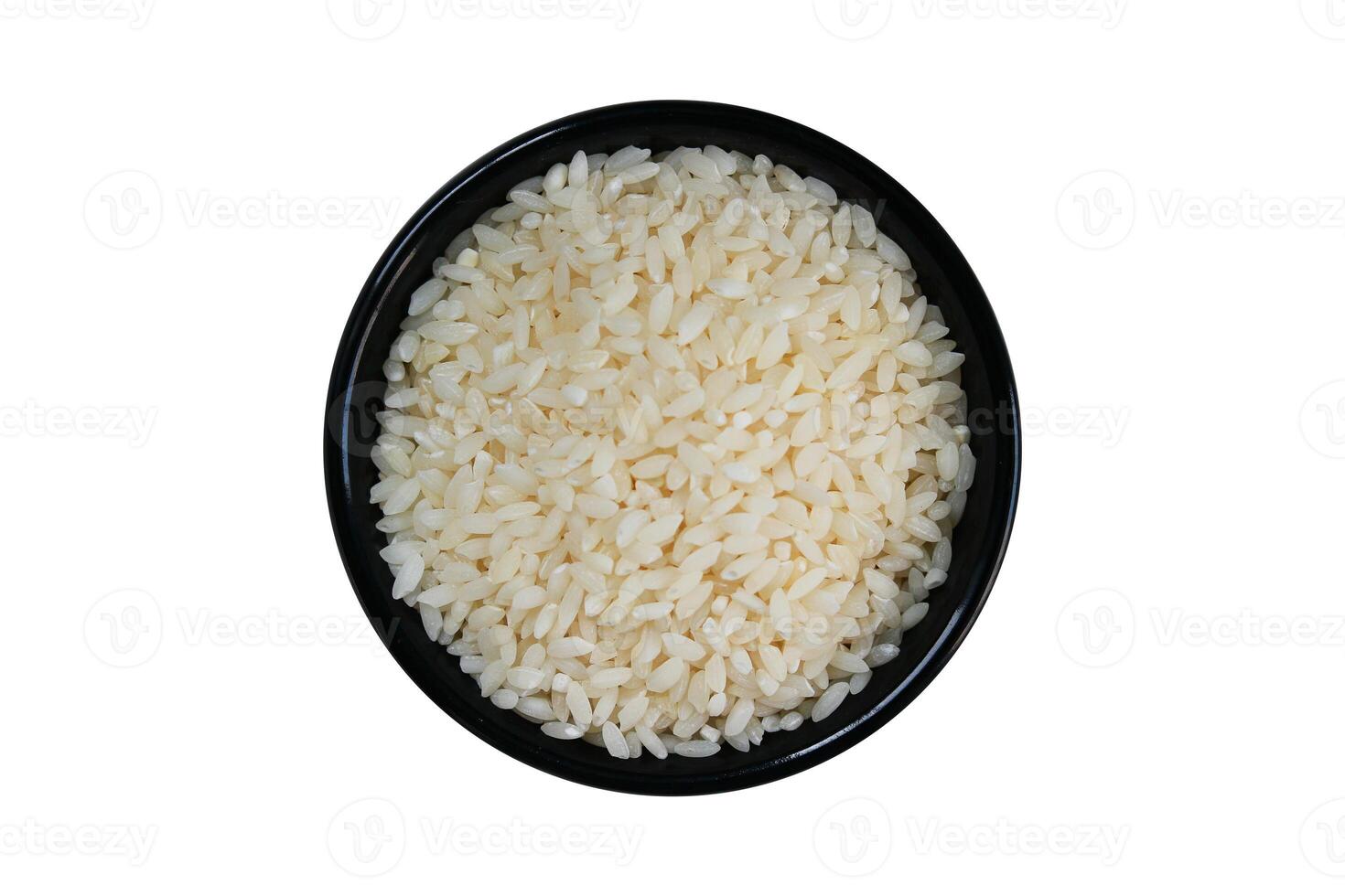 Rice in black bowl isolated on white background with clipping path. photo