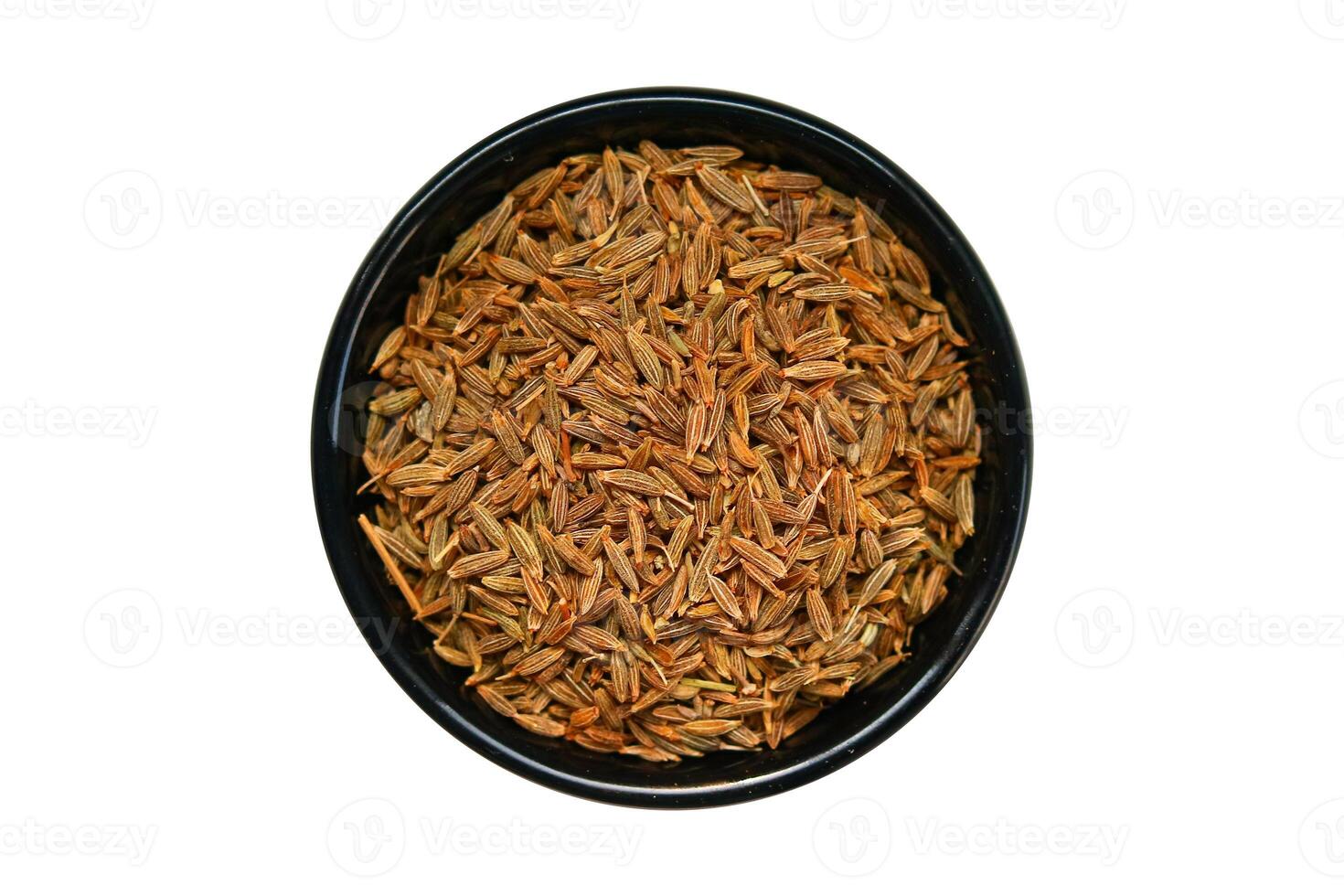 Cumin seeds in a black bowl isolated on a white background. photo