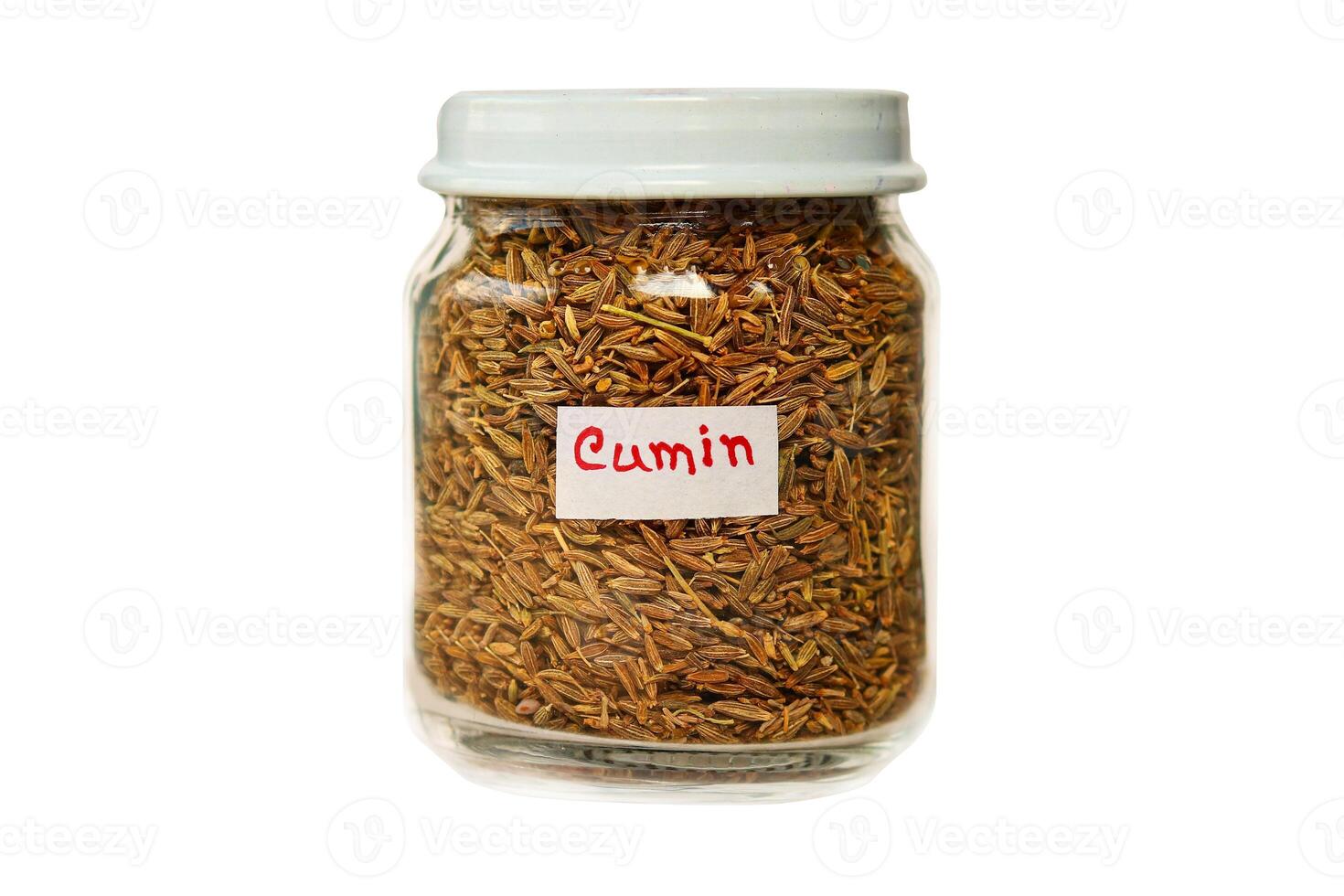 Cumin in a glass jar isolated on a white background. photo