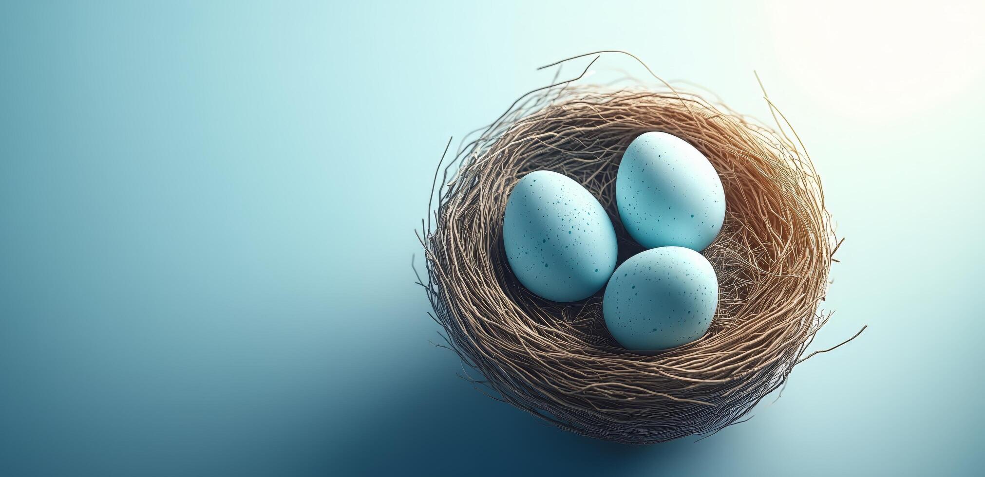 Three blue eggs resting in a natural nest with soft straw on a light blue background photo