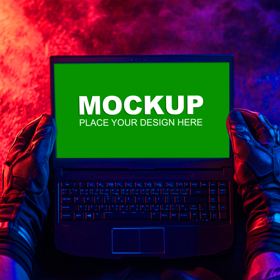 mockup of a laptop with a green screen and a person wearing gloves psd