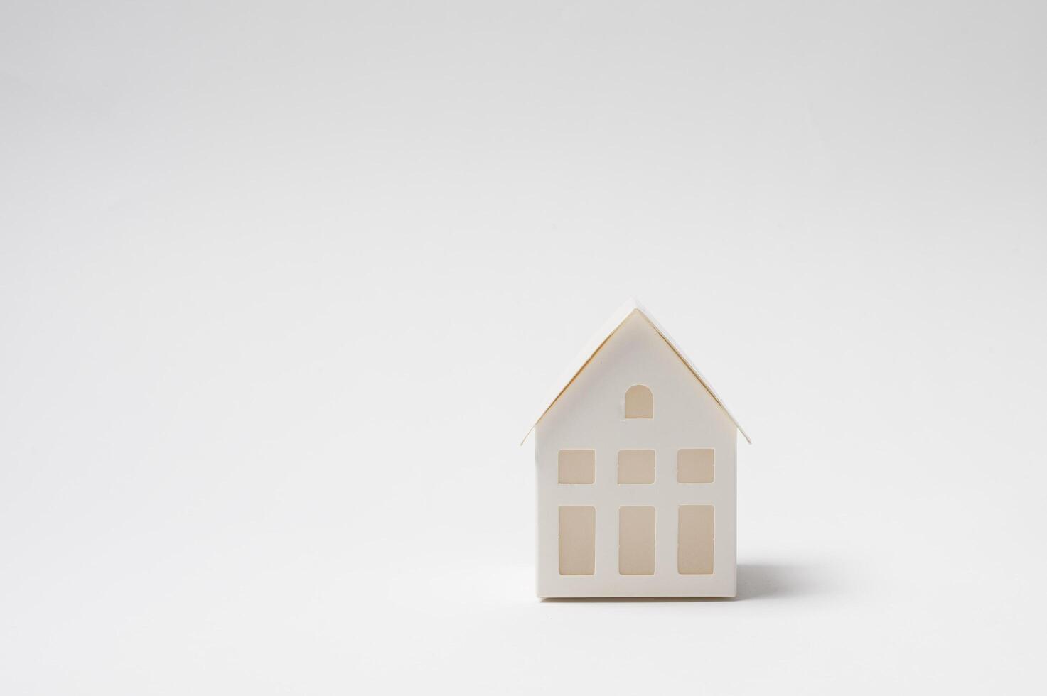 Small House Model on a Plain Background photo