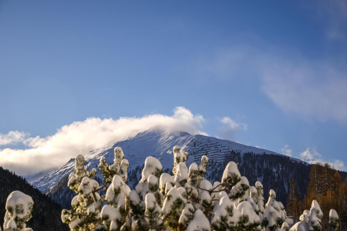 Moving clouds in winter in the Swiss Alps, Grisons, Switzerland photo