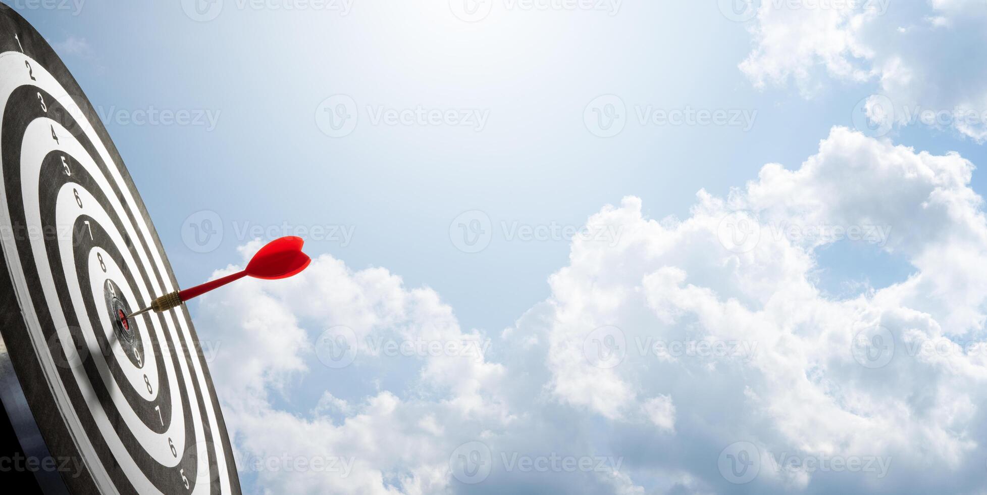 dart on target board with cloud background photo