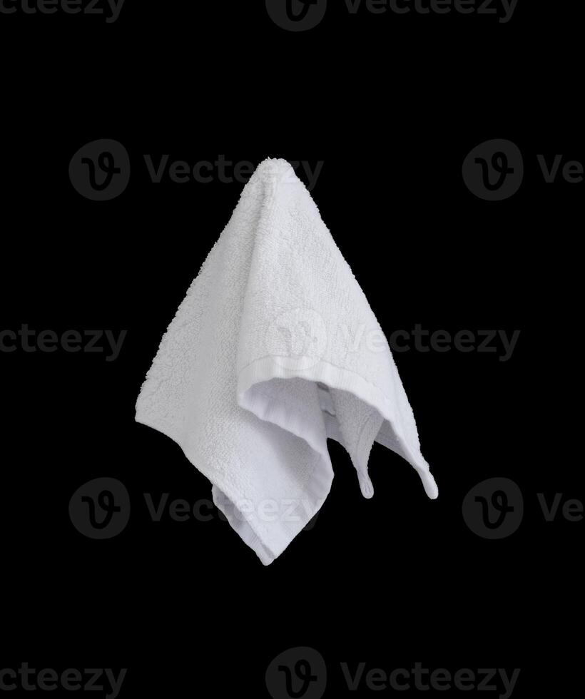 white face towel isolated on black background photo