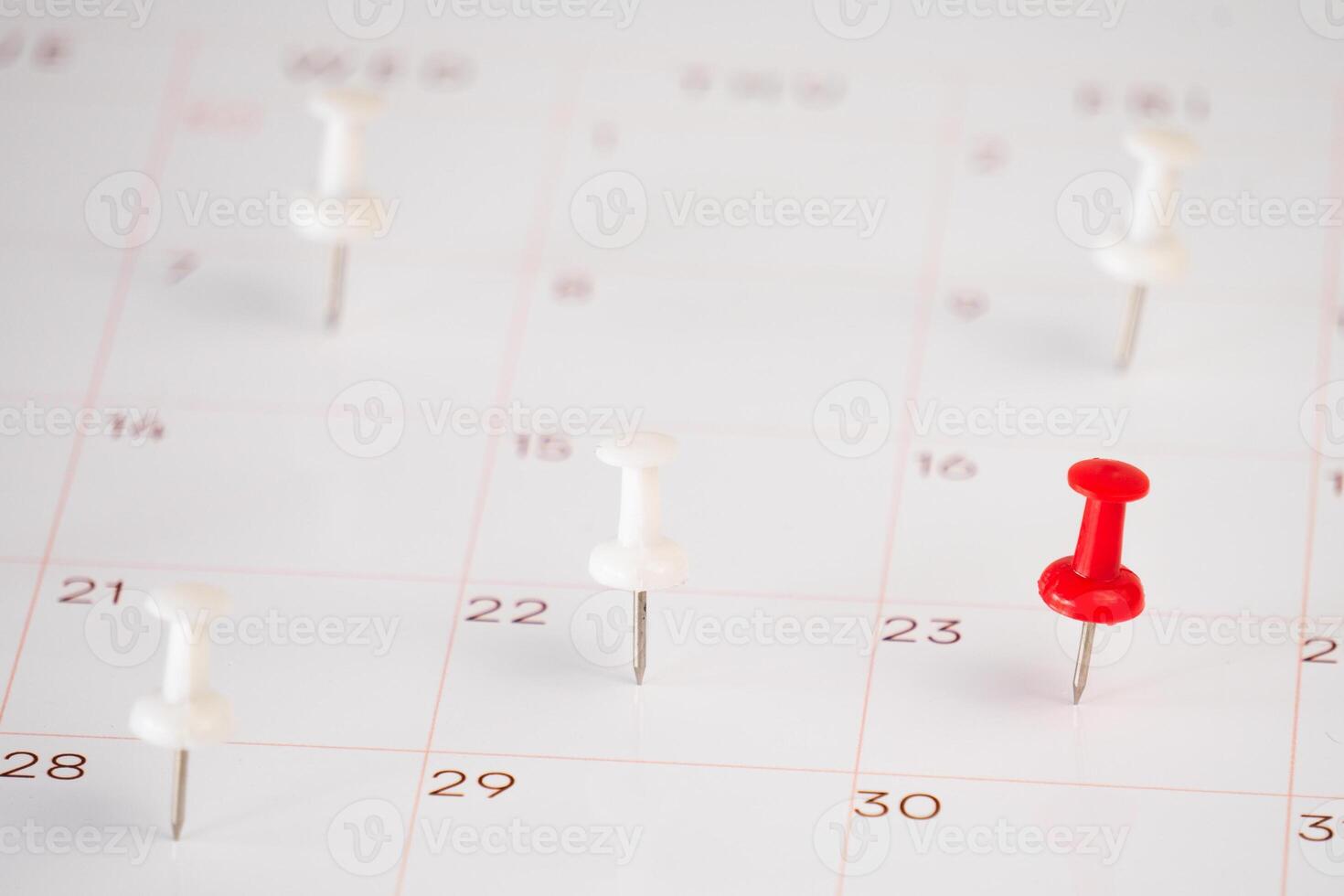 push pin with close up calendar photo