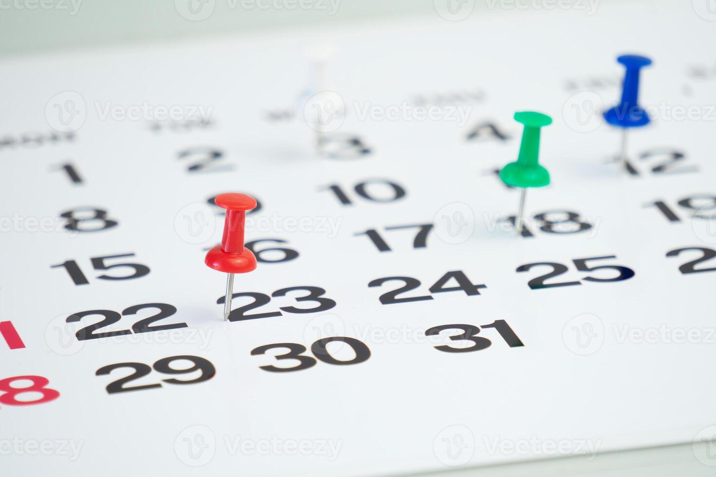 deadline concept with push pin on calendar photo