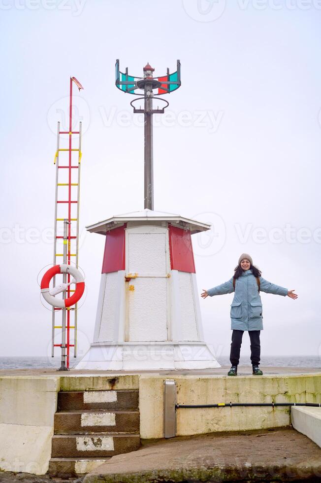 A woman and a lighthouse Lomma Sweden 2025 photo