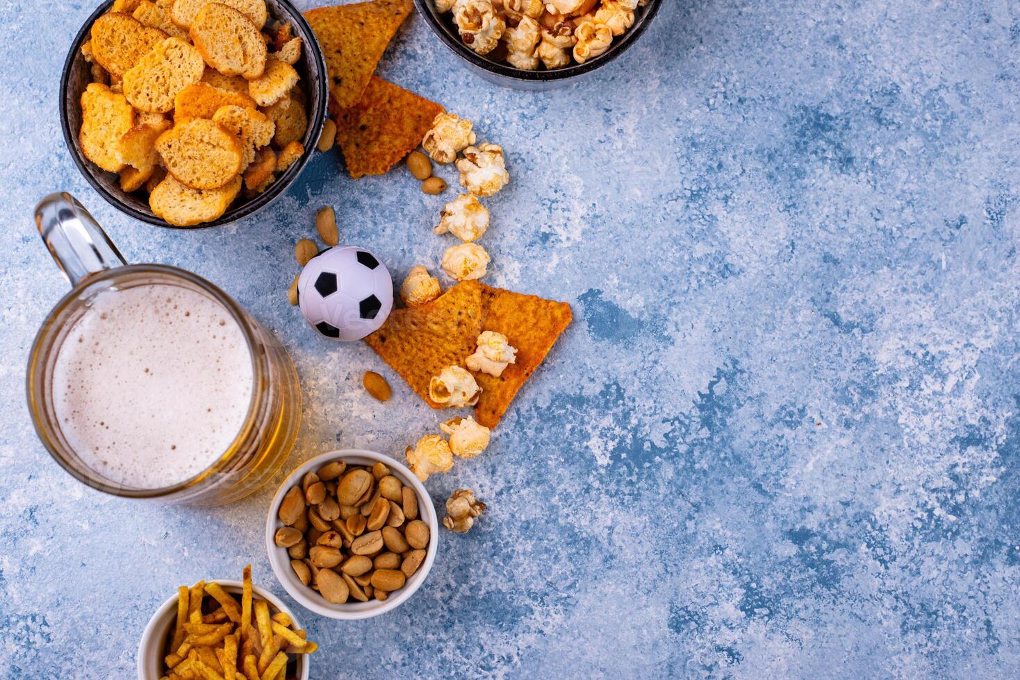 Beer and different snacks for Superbowl or football party photo