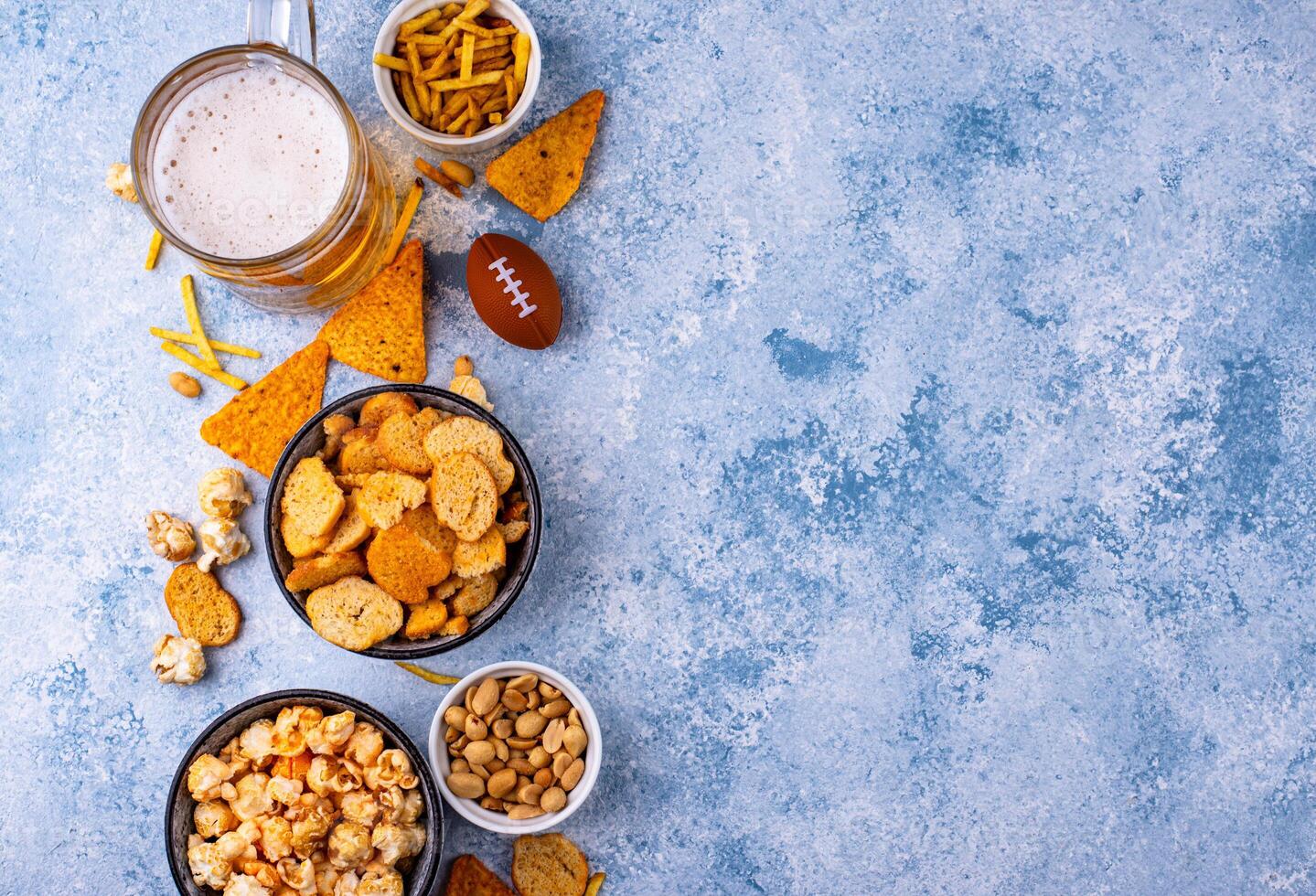 Beer and different snacks for Superbowl or football party photo