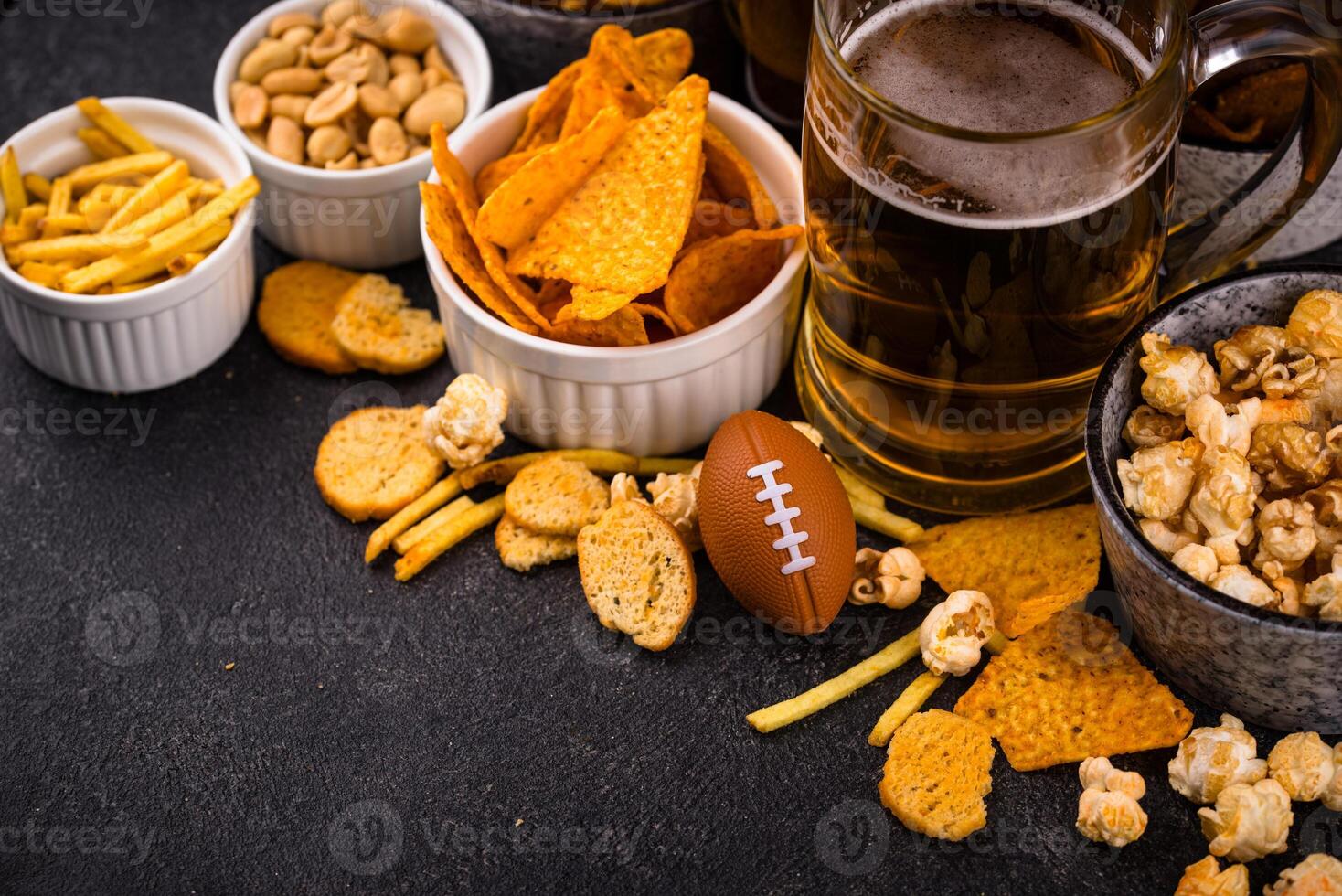 Beer and different snacks for Superbowl or football party photo