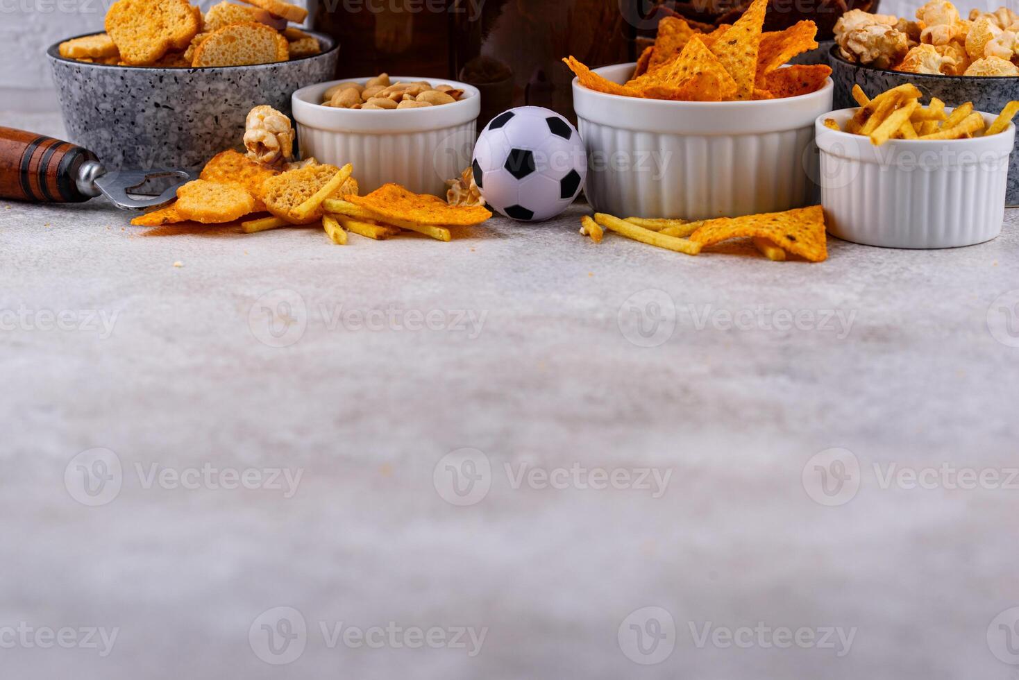 Beer and different snacks for Superbowl or football party photo