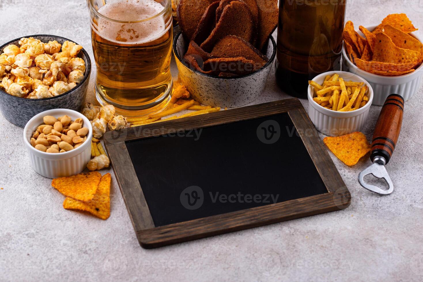 Beer and different snacks for Superbowl or football party photo